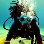 Student learning Spanish and Scuba Diving at IIC Spanish School in Sosua, Dominican Republic, enjoys his first scuba diving experience in Sosua Bay.