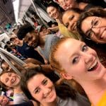 A group of Spanish language students who are learing Spanish at IIC Spanis School, Dominican Republic, in the Metro subway in Santo Domingo on the city orientation activity after the first day of class.