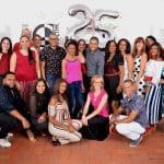 Team of IIC Spanish School in the Dominican Republic groups for a picture to celebrate the school's 25th anniversary.