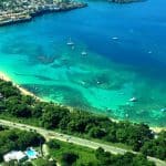 One of the Things to Do in Sosua Dominican Republic is to visit Sosua beach, tucked in a small bay with crystal-clear water.