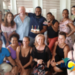 Student facilitator Jeffry Meson celebrates its birthday with his colleagues and students learning Spanish at IIC Spanish School in Sosua, Dominican Republic.