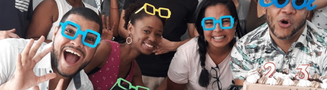 Spanish language students in funny poses and with glasses celebrating at IIC Spanish School. Spanish Language Day Anniversary