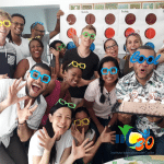 Spanish language students in funny poses and with glasses celebrating at IIC Spanish School. Spanish Language Day Anniversary